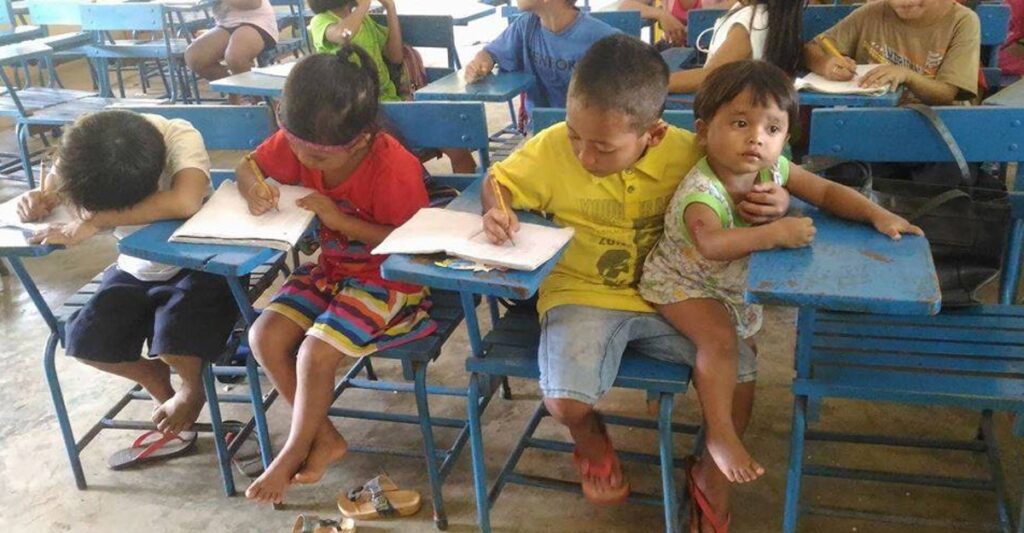 Boy takes responsibility for his little sister and brings her to school so he doesn’t have to miss out on his education.